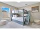 Charming bedroom featuring a twin over twin bunk bed with stairs and stylish decor at 2406 Placid Way, Kissimmee, FL 34758