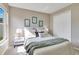 Cozy bedroom features a large window, plush bedding, and ample natural light at 2406 Placid Way, Kissimmee, FL 34758