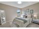 Charming bedroom featuring a comfortable bed, stylish nightstands and tasteful wall art at 2406 Placid Way, Kissimmee, FL 34758
