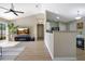 Open-concept living area flows into the kitchen, creating a spacious and inviting atmosphere with ample natural light at 2406 Placid Way, Kissimmee, FL 34758