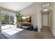 Bright and airy living room with vaulted ceiling and seamless indoor-outdoor flow to the screened patio and pool at 2406 Placid Way, Kissimmee, FL 34758