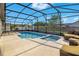 Screened-in pool area with ample space for relaxing and entertaining at 2406 Placid Way, Kissimmee, FL 34758