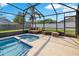 Inviting screened-in pool and spa complemented by comfortable outdoor seating at 2406 Placid Way, Kissimmee, FL 34758