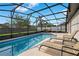 Screened-in pool and spa, complete with lounge chairs for ultimate relaxation at 2406 Placid Way, Kissimmee, FL 34758
