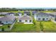 Aerial view of backyard featuring green lawn, patio and privacy fence at 2836 Sanctuary Dr, Clermont, FL 34714