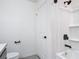 Clean bathroom featuring shower-tub combo with dark hardware and fixtures at 2836 Sanctuary Dr, Clermont, FL 34714