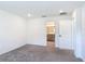 Bedroom with neutral colored carpeting and adjacent bathroom at 2836 Sanctuary Dr, Clermont, FL 34714