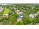 The home, pool, and verdant setting are highlighted in this expansive aerial view at 2901 Autumnwood Trl, Apopka, FL 32703