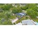 Beautiful aerial view of the home showcasing the pool, trees, and lush landscape at 2901 Autumnwood Trl, Apopka, FL 32703