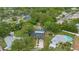 Serene aerial view of a property nestled among mature trees with a pool at 2901 Autumnwood Trl, Apopka, FL 32703