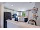 Well-lit kitchen with white cabinets, black appliances, and butcher block countertops at 2901 Autumnwood Trl, Apopka, FL 32703