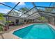 Screened pool with ample patio space for entertaining, along with table tennis and seating at 2901 Autumnwood Trl, Apopka, FL 32703
