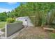 Backyard storage shed with natural surroundings and space for lawncare equipment at 2901 Autumnwood Trl, Apopka, FL 32703