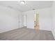 Bedroom featuring neutral carpet, white walls, and entryways to other rooms at 3210 Viceroy Ct, Poinciana, FL 34759
