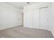 A carpeted bedroom offers ample storage with a large closet and a bright, open feel at 3210 Viceroy Ct, Poinciana, FL 34759