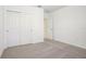 A cozy bedroom includes a closet with doors and carpeted flooring for comfort at 3210 Viceroy Ct, Poinciana, FL 34759
