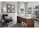 Well-appointed home office with a modern desk, comfortable chair, and ample storage space at 3210 Viceroy Ct, Poinciana, FL 34759