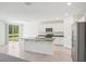 Open-concept kitchen with stainless steel appliances and granite countertops at 3210 Viceroy Ct, Poinciana, FL 34759
