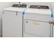 The Laundry Room features new, modern, white, Whirlpool washer and dryer at 3210 Viceroy Ct, Poinciana, FL 34759