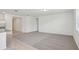 Open-concept living room area featuring neutral tones and large picture window at 3210 Viceroy Ct, Poinciana, FL 34759
