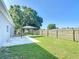 Large backyard with fence, lawn and canopy on concrete patio at 344 Buenaventura Blvd, Kissimmee, FL 34743