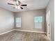 Bedroom featuring wood-look floors, a ceiling fan, and bright natural light at 344 Buenaventura Blvd, Kissimmee, FL 34743