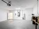 Spacious garage with gray floor, overhead door, and white block walls at 344 Buenaventura Blvd, Kissimmee, FL 34743