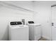 Bright laundry room with a side-by-side washer and dryer at 344 Buenaventura Blvd, Kissimmee, FL 34743