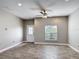Living room featuring recessed lighting, ceiling fan and decorative front door at 344 Buenaventura Blvd, Kissimmee, FL 34743