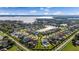 Areal view showcasing a residential area and a tranquil lake, with homes lining the waterfront at 4071 Isabella Cir, Windermere, FL 34786