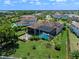 Aerial shot of the property with screened lanai, manicured backyard, and the surrounding neighborhood and lakes at 4071 Isabella Cir, Windermere, FL 34786