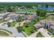 Aerial shot with a green pin marking the property within a beautiful community near a lake at 4071 Isabella Cir, Windermere, FL 34786