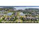 Aerial view of a neighborhood with beautiful homes, ponds, and tree-lined streets at 4071 Isabella Cir, Windermere, FL 34786