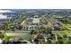 High aerial view of a residential community featuring beautiful homes, a lake, and lush landscaping at 4071 Isabella Cir, Windermere, FL 34786