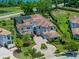 Gorgeous aerial view of an estate home featuring mature landscaping, circular drive, and an oversized lot at 4071 Isabella Cir, Windermere, FL 34786