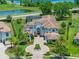 Stunning aerial view of the estate, highlighting the circular driveway, lush landscaping, and waterfront location at 4071 Isabella Cir, Windermere, FL 34786
