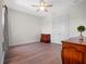 Empty bedroom features hardwood floors, a ceiling fan, double closets, and warm paint at 4071 Isabella Cir, Windermere, FL 34786