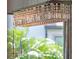 Close up of the stylish crystal chandelier in dining room with outdoor views at 4071 Isabella Cir, Windermere, FL 34786