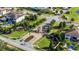 Aerial view of Casabella at Windermere neighborhood entrance with lush landscaping and brick-paved roundabout at 4071 Isabella Cir, Windermere, FL 34786