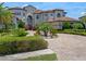 Luxury estate with manicured landscaping, circular driveway, and an attached three-car garage at 4071 Isabella Cir, Windermere, FL 34786