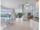 Open-concept living area with floor-to-ceiling windows, a chandelier, and access to the pool area at 4071 Isabella Cir, Windermere, FL 34786