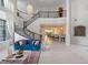 Open-concept floor plan showcasing soaring ceilings, spiral staircase, and gourmet kitchen at 4071 Isabella Cir, Windermere, FL 34786