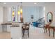 Open floor plan from kitchen to living room with pendant lighting at 4071 Isabella Cir, Windermere, FL 34786