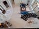 Grand foyer with curved staircase leads to a living room with bright blue couches and a red oriental rug at 4071 Isabella Cir, Windermere, FL 34786