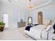 Bright and airy main bedroom featuring ensuite bathroom and accent lighting at 4071 Isabella Cir, Windermere, FL 34786