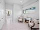 Bright sitting area with tiled floors, modern fireplace, and comfortable chairs at 4071 Isabella Cir, Windermere, FL 34786