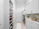 Spacious walk-in closet with custom shelving and storage space at 4071 Isabella Cir, Windermere, FL 34786