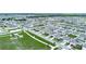 Aerial view of community homes with sidewalks and green spaces at 440 Patricia Alford Dr, Haines City, FL 33844