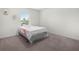 Simple bedroom with neutral carpet, a full bed, and decor accents on the walls and window at 440 Patricia Alford Dr, Haines City, FL 33844