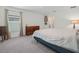 Cozy bedroom features soft carpet, natural light, and a classic wood dresser for ample storage at 440 Patricia Alford Dr, Haines City, FL 33844